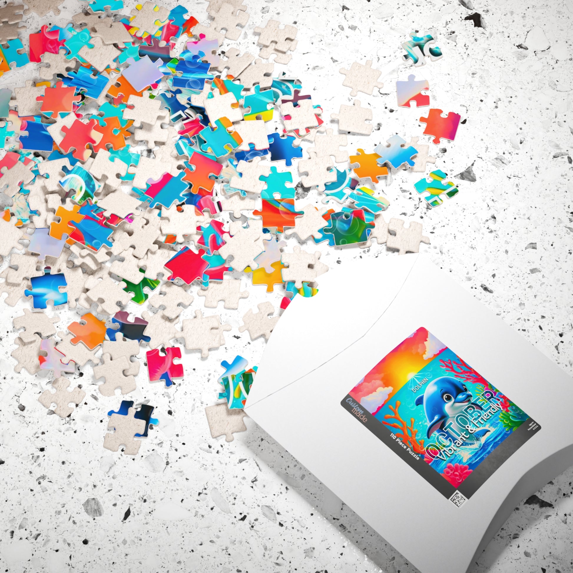 Kids birth month puzzle with colorful ocean-themed pieces scattered on white surface
