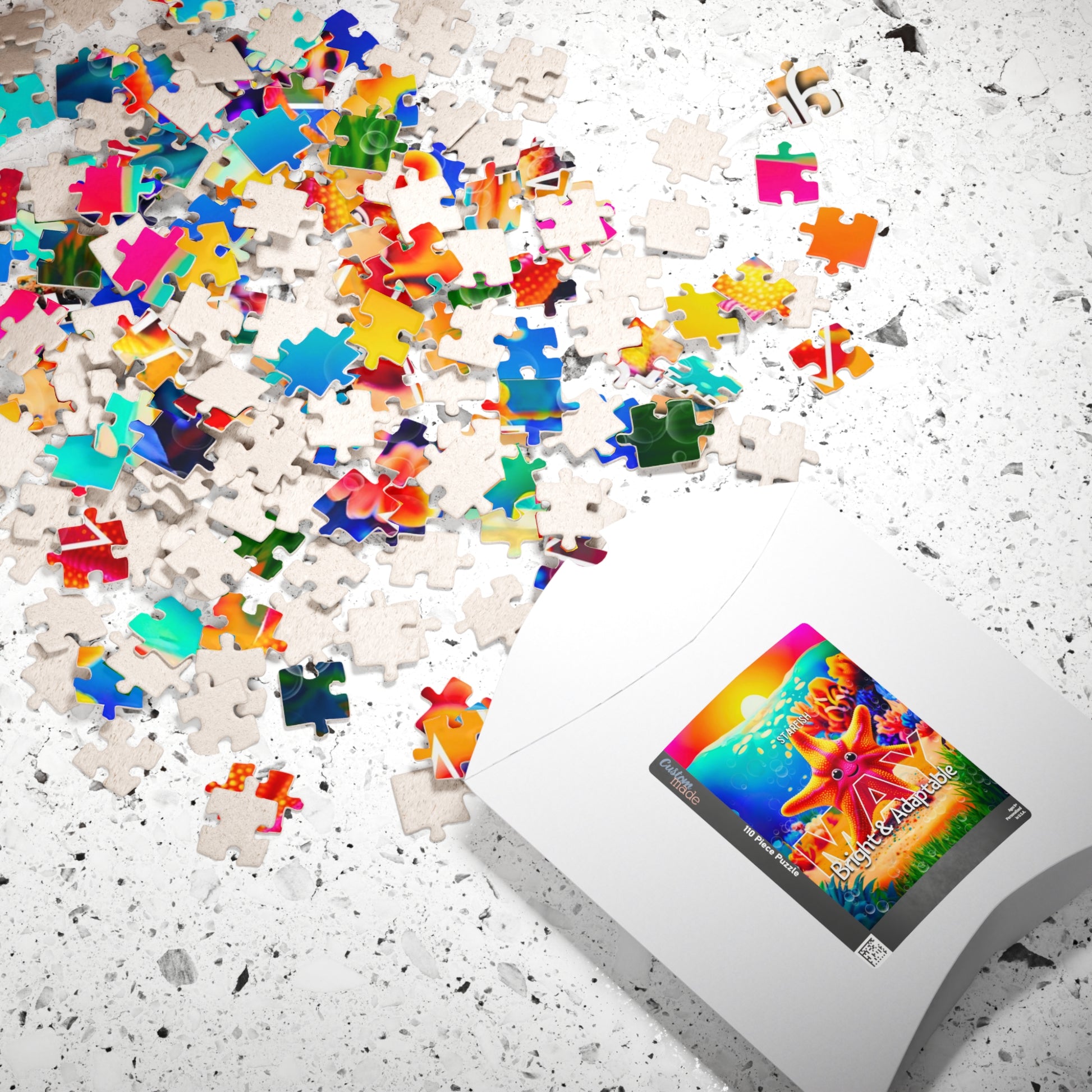 Kids birth month puzzle with colorful scattered pieces and starfish design box on a white surface