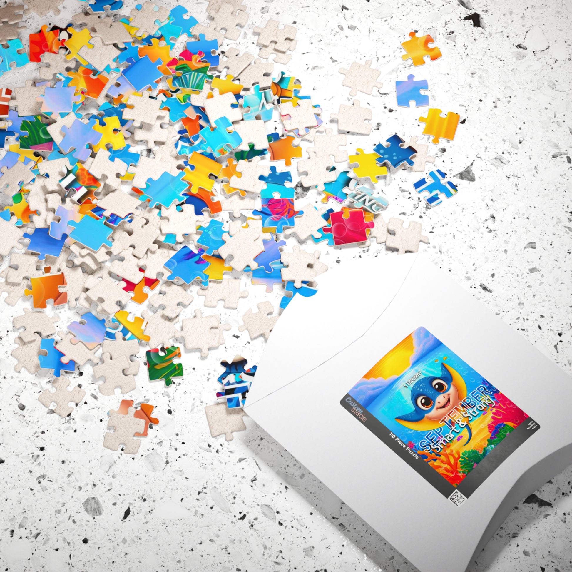 Kids birth month puzzle with colorful scattered pieces and playful animal design on white surface