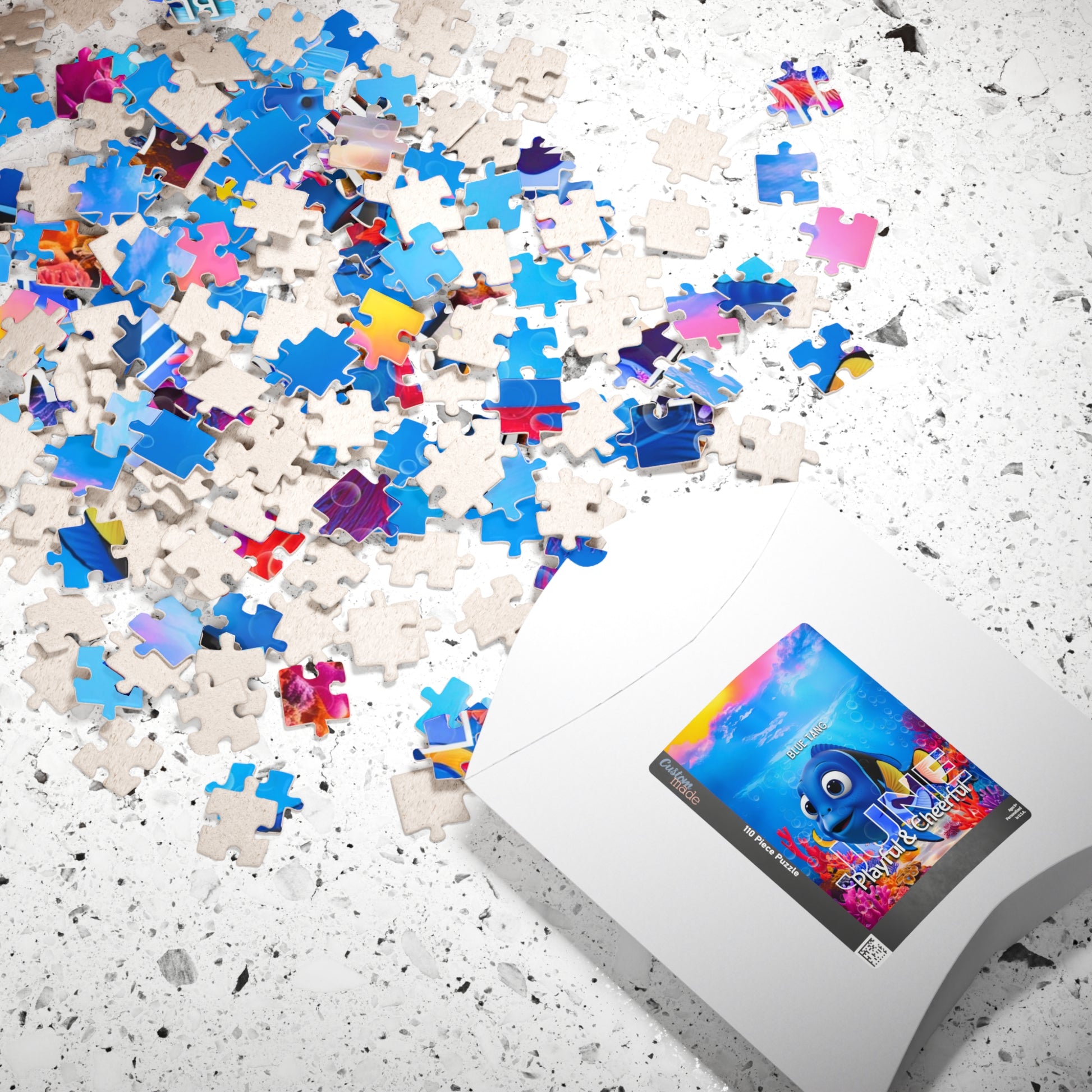 Kids birth month puzzle with colorful scattered pieces and themed packaging on a textured surface
