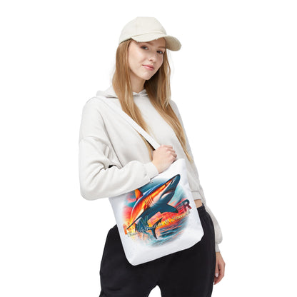 Young woman wearing a birth month beach tote with colorful shark design over shoulder