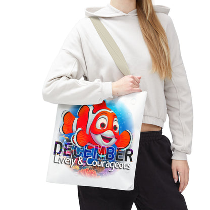 Kids birth month beach tote bag with colorful December clownfish design, and lively courageous text