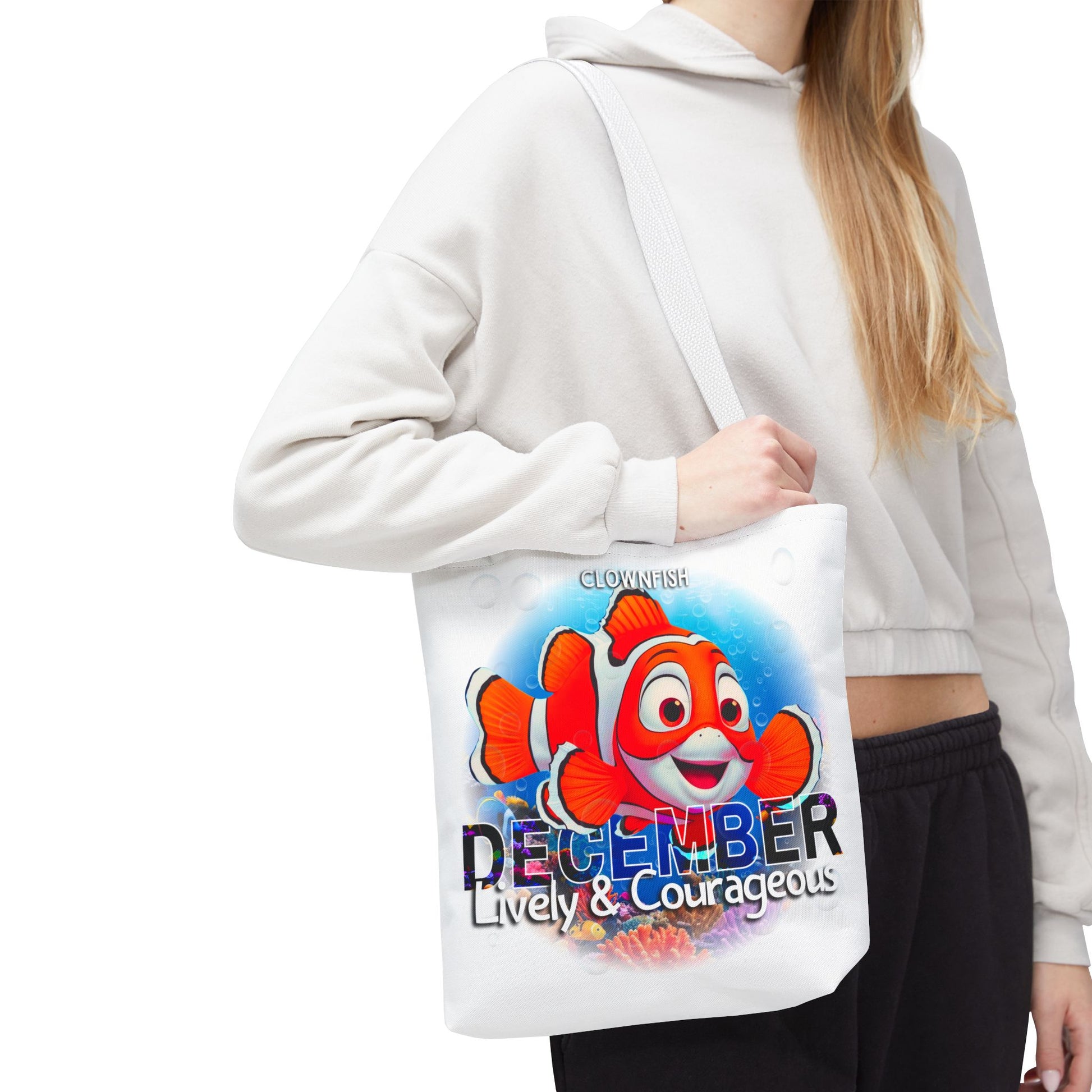 Kids birth month beach tote bag with colorful clownfish and December lively and courageous design