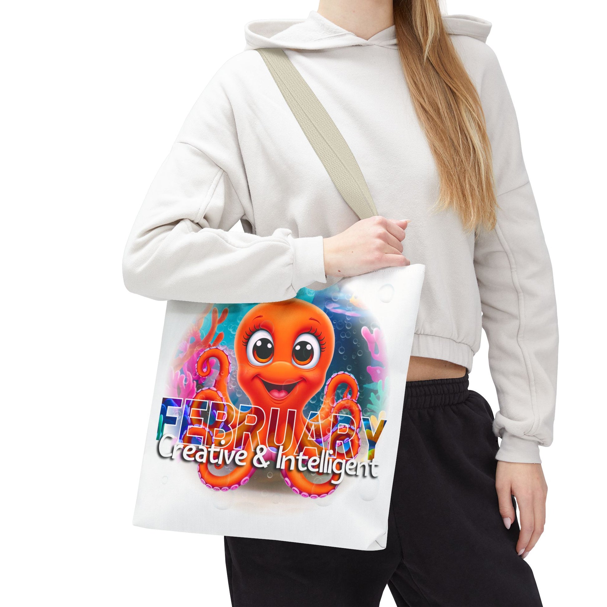 Kids birth month beach tote bag with colorful February octopus design held by woman in casual outfit