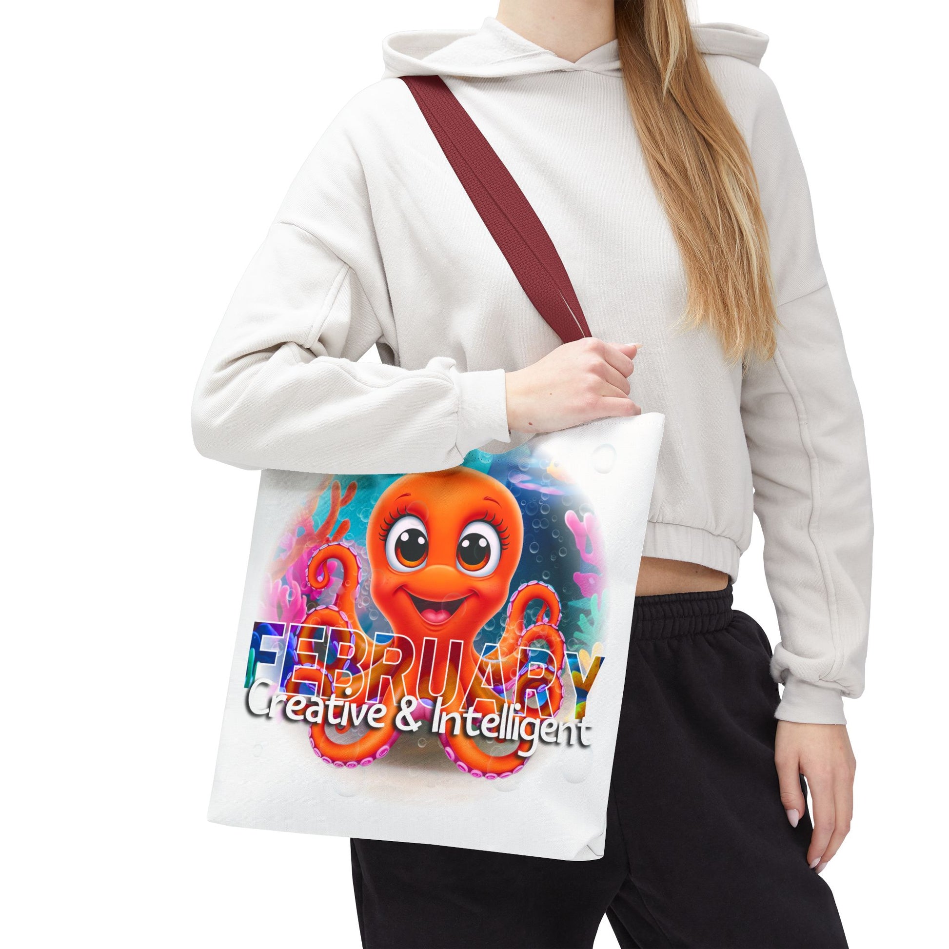 Kids birth month beach tote bag with colorful February octopus design carried by woman
