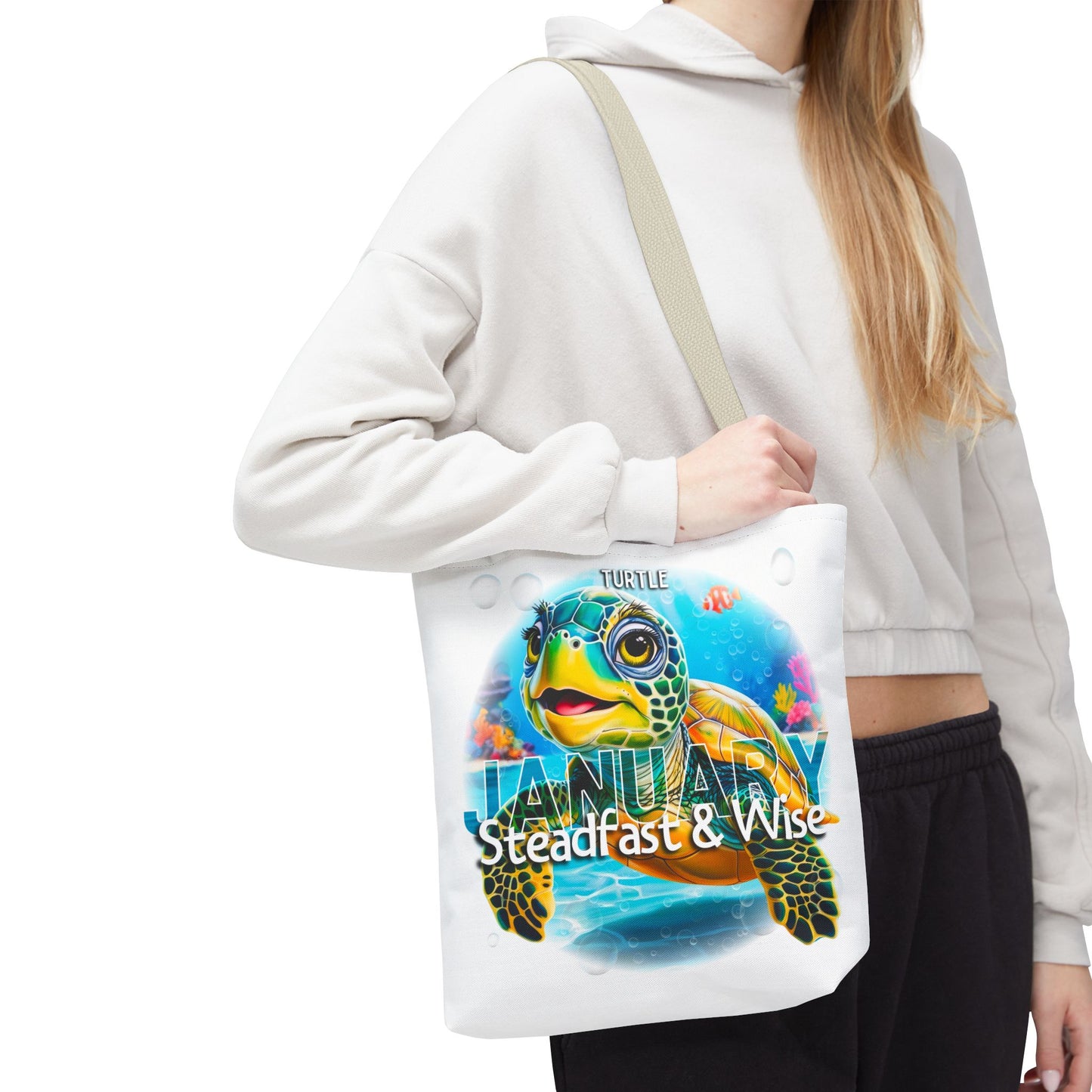 Kids birth month beach tote bag with colorful January turtle design held by woman