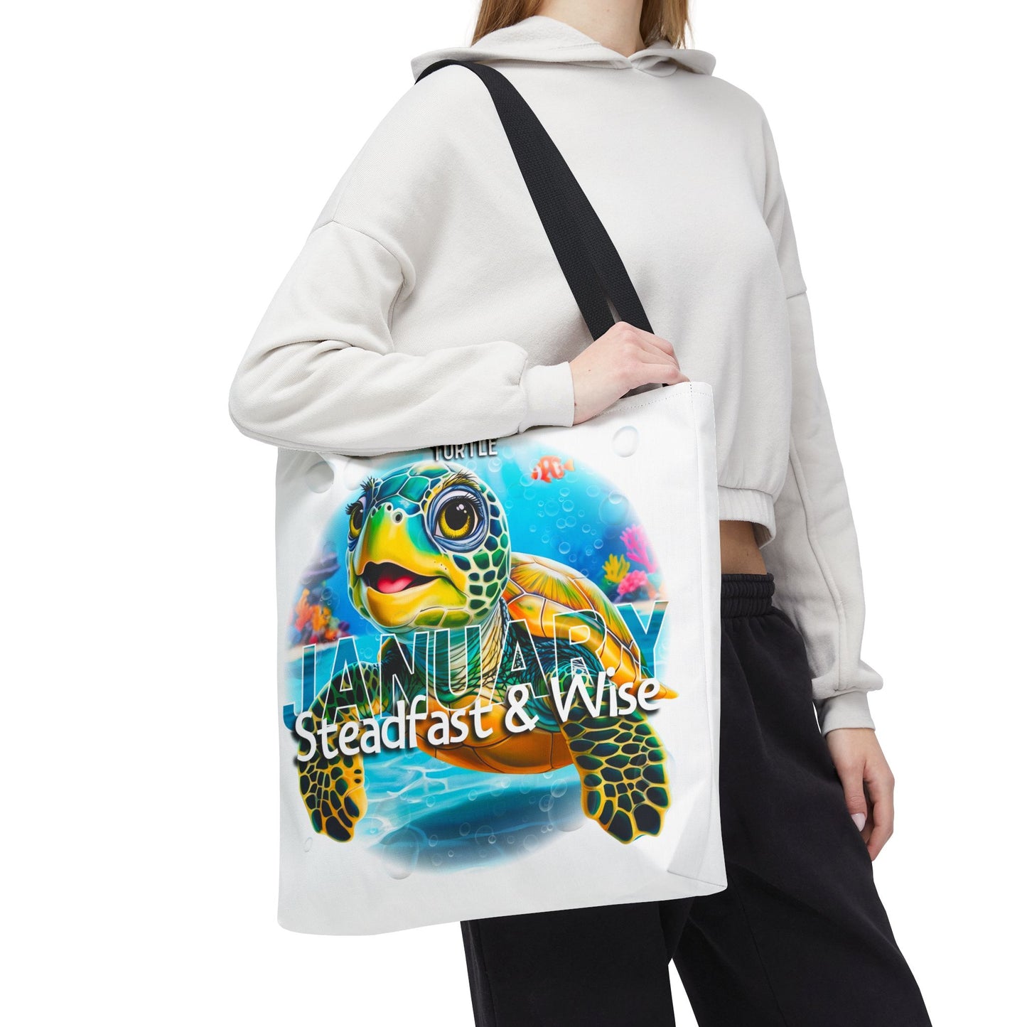 Kids birth month beach tote bag with colorful January turtle design and black shoulder strap