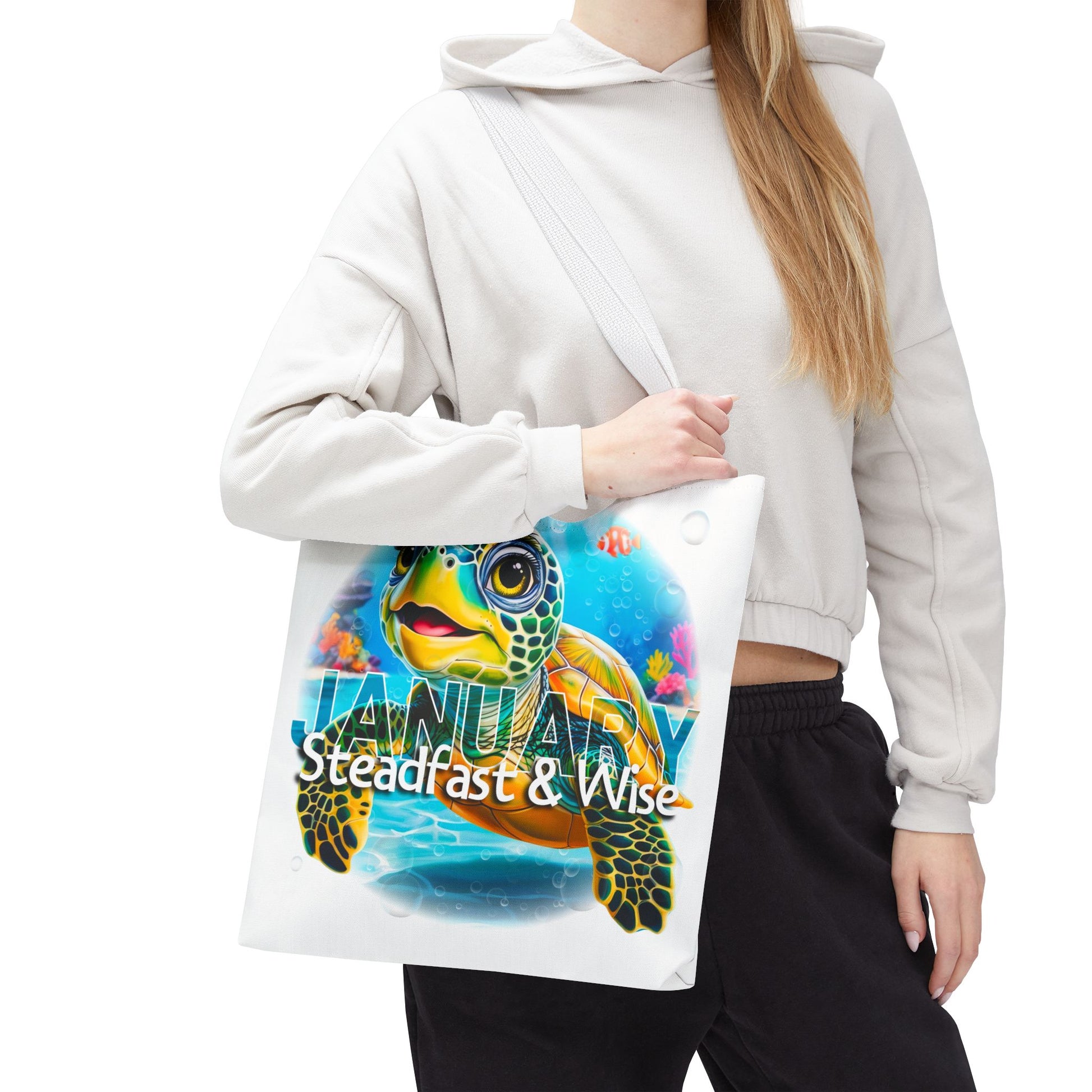 Kids birth month beach tote bag with colorful turtle and January text carried by woman