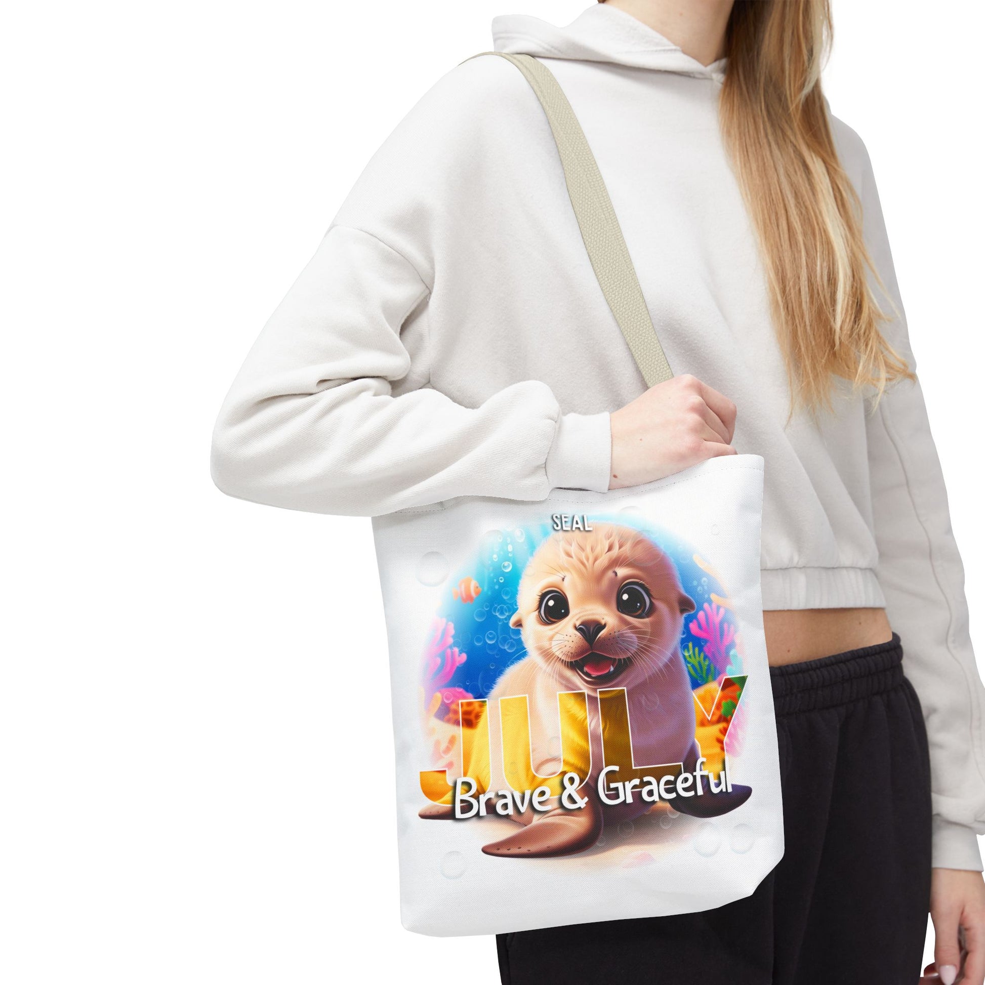 Kids birth month beach tote bag with cute seal design and Brave & Graceful text