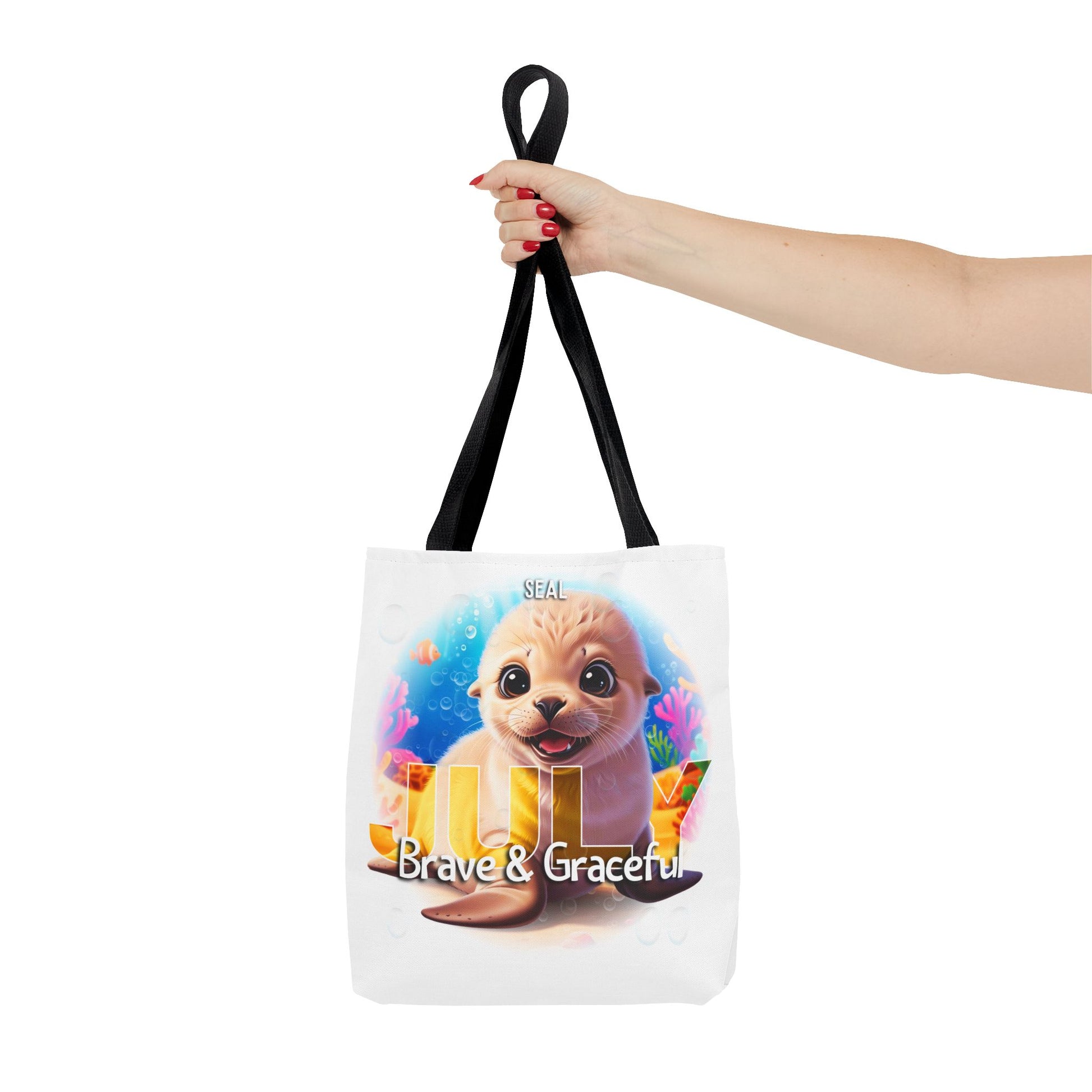 Kids birth month beach tote bag featuring a cute seal design with July text and Brave and Graceful message