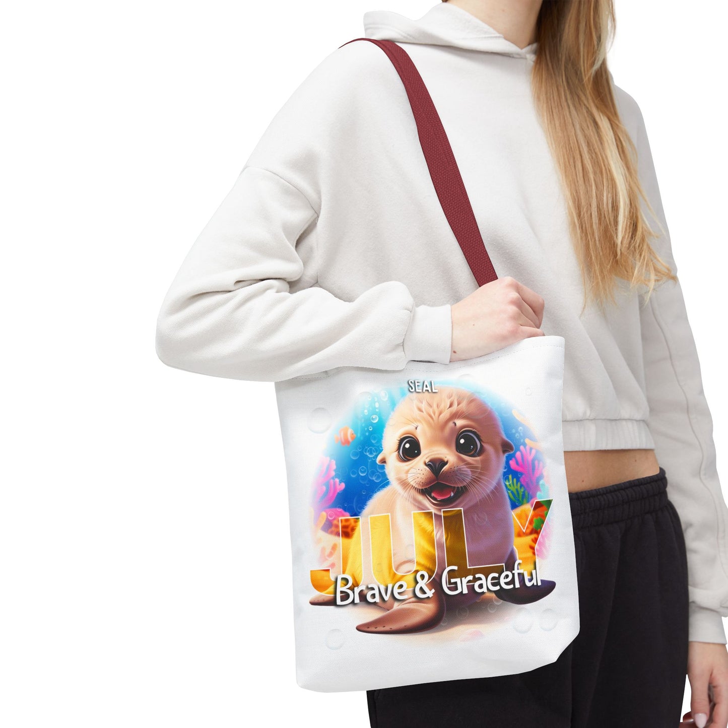 Kids birth month beach tote bag with cute seal design and Brave and Graceful text