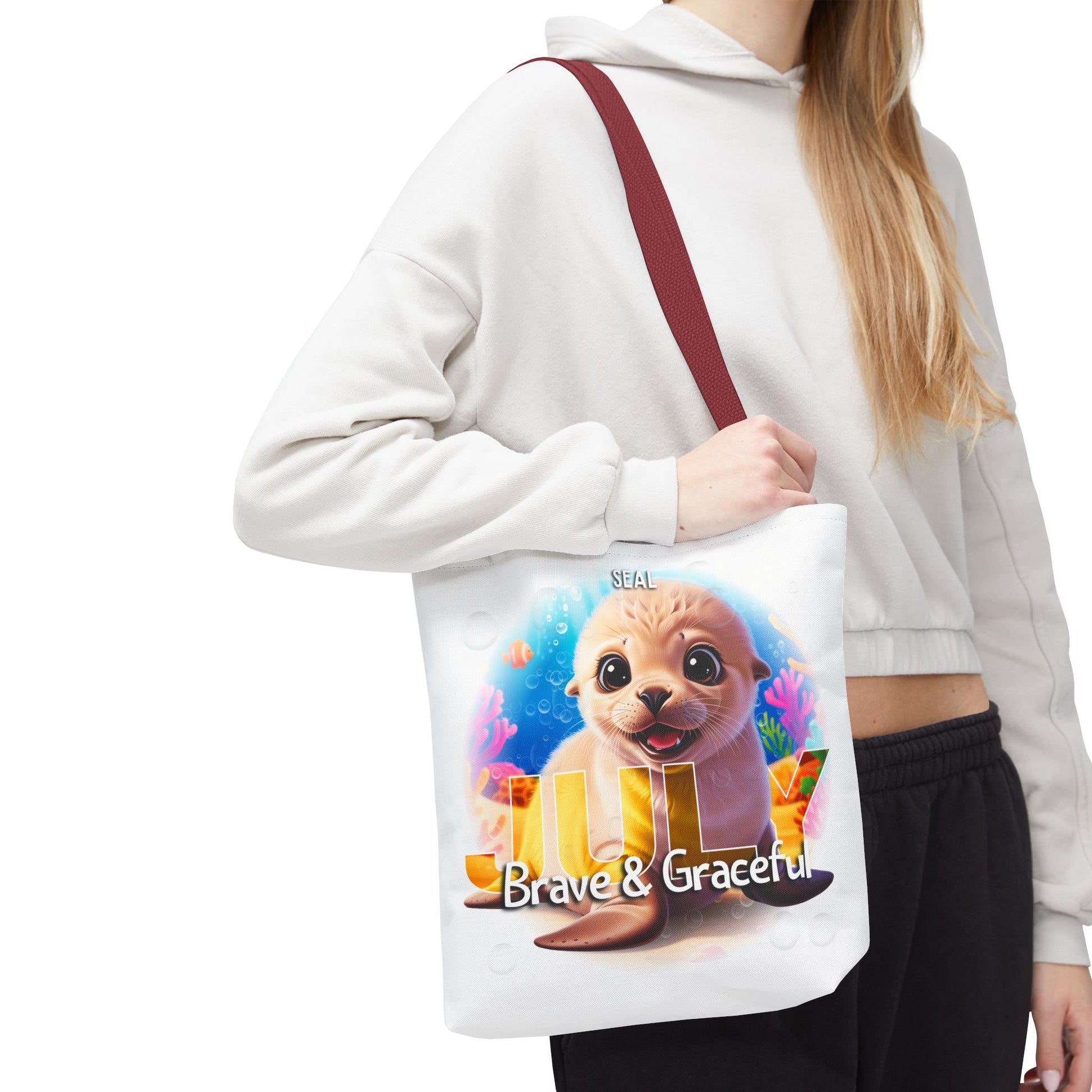 Kids birth month beach tote bag with cute seal design and Brave and Graceful text