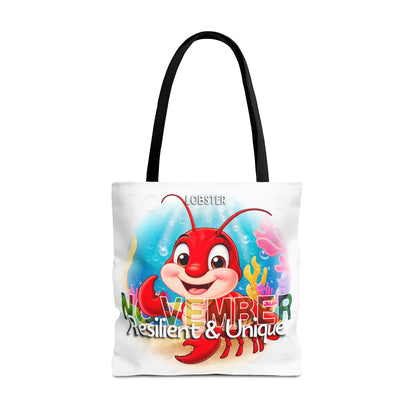 Kids birth month beach tote bag with colorful November lobster design and black handles