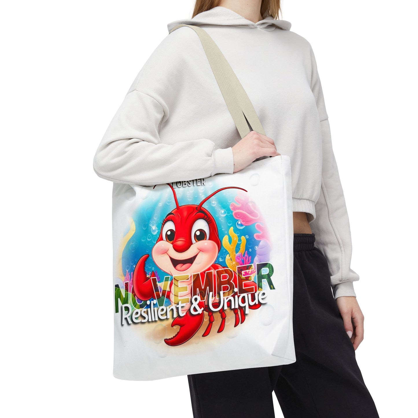 Kids birth month beach tote bag with November lobster design and Resilient and Unique text