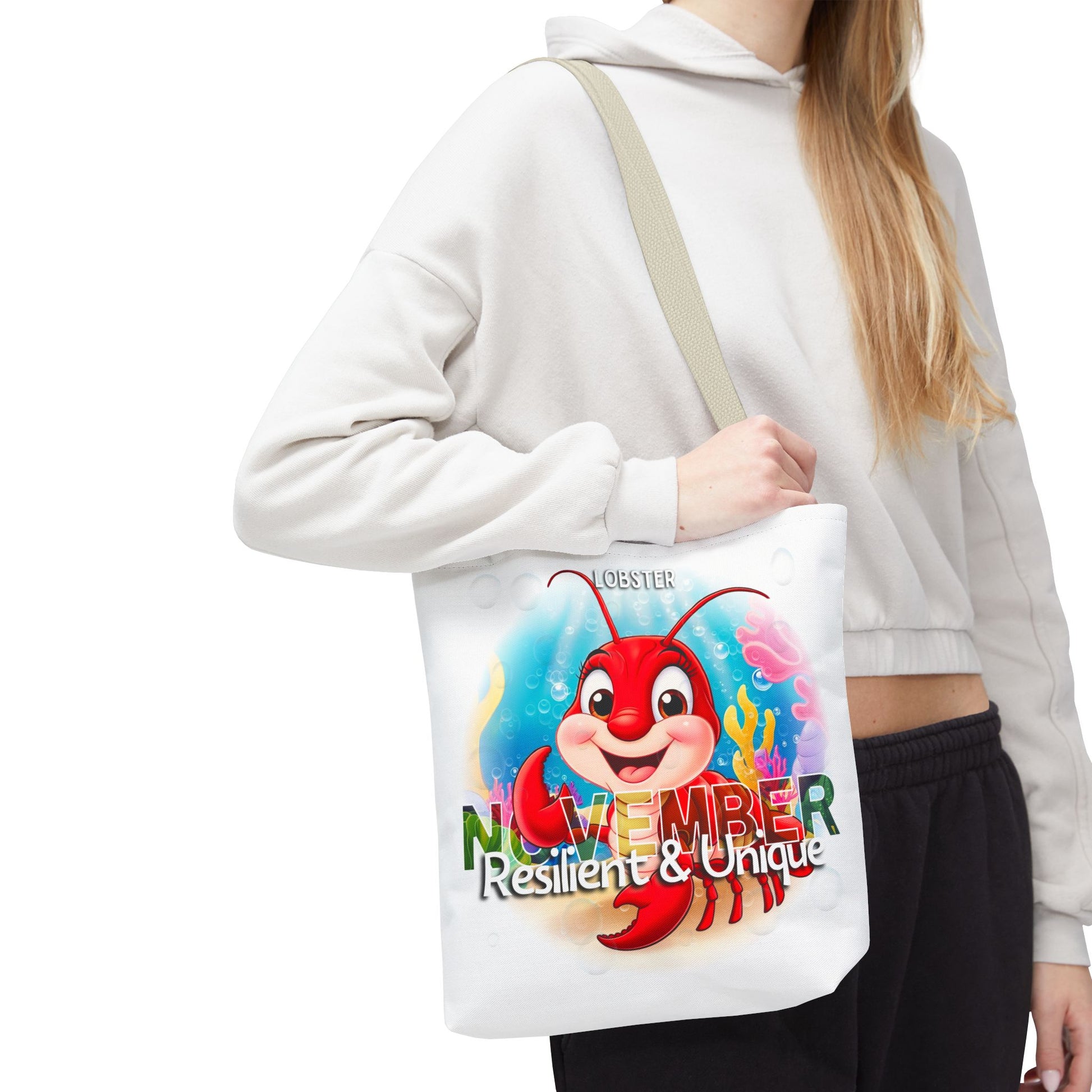 Kids birth month beach tote bag featuring November lobster design with resilient and unique text