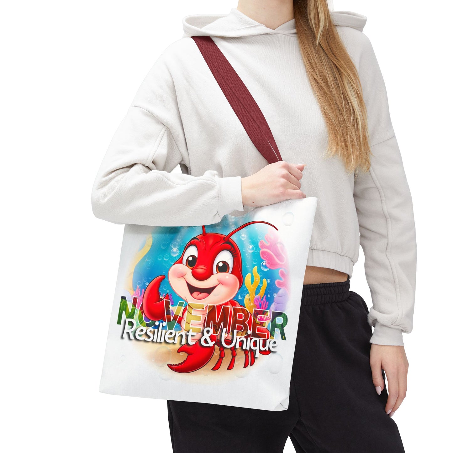Kids birth month beach tote bag featuring November design with a cheerful lobster and colorful underwater background