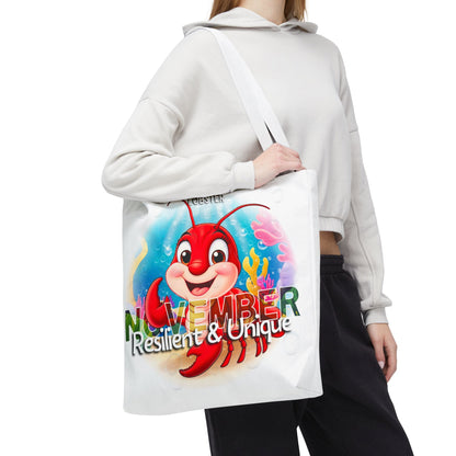 Kids birth month beach tote bag with colorful November lobster design and Resilient Unique text