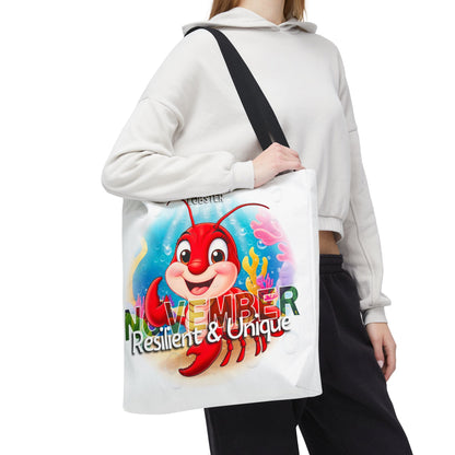 Birth month beach tote bag with colorful November design featuring a cheerful lobster and text resilient and unique