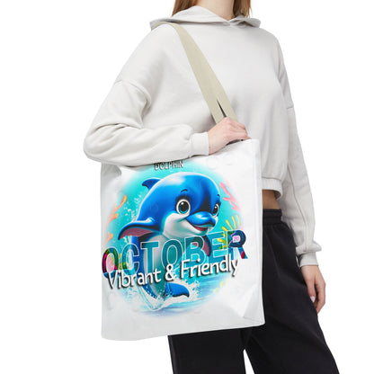 Kids birth month beach tote bag with vibrant dolphin and October design worn by person