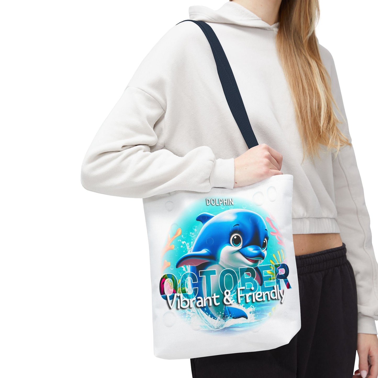 Kids birth month beach tote bag featuring a vibrant dolphin and October design carried by a person