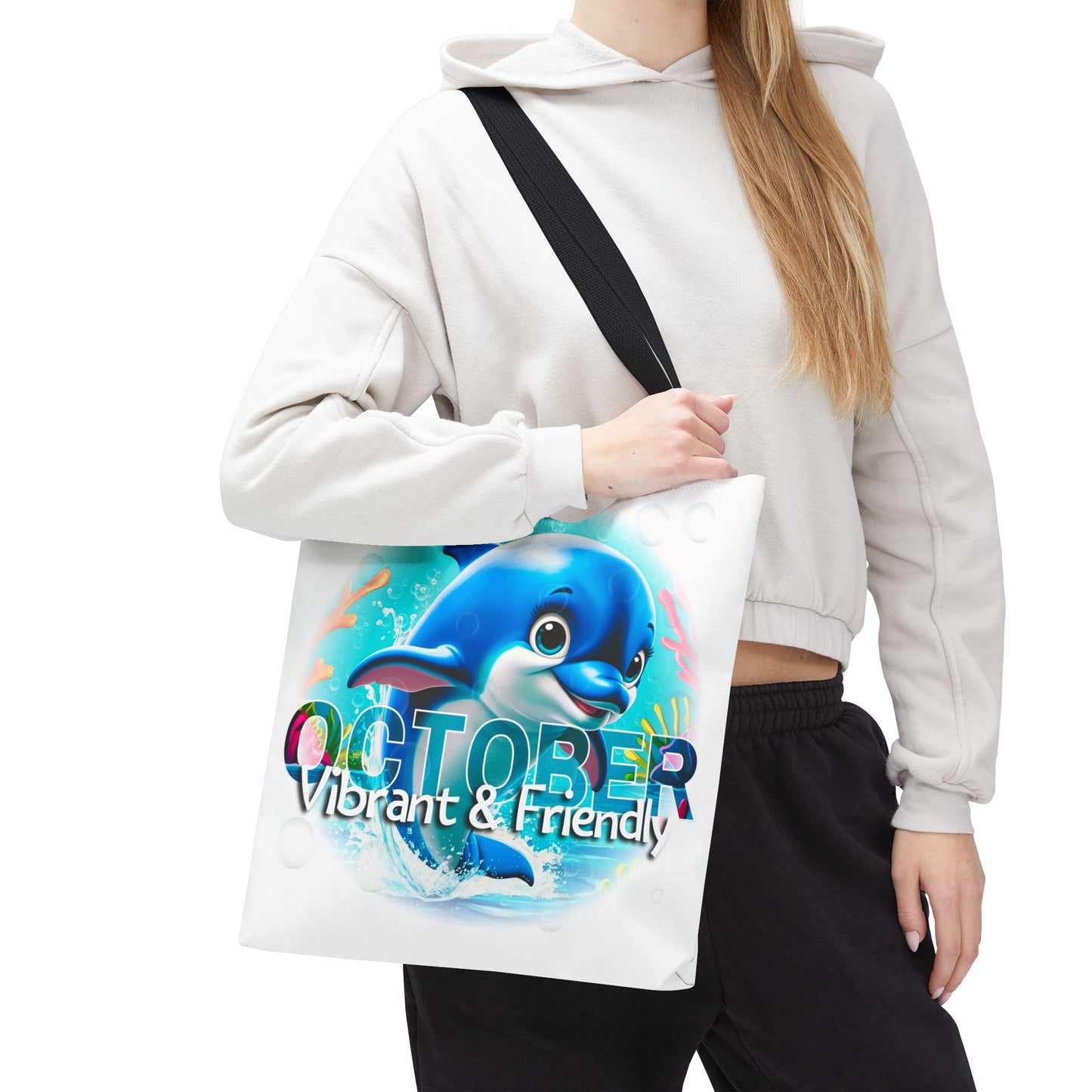 Kids birth month beach tote bag with vibrant October dolphin design carried by woman
