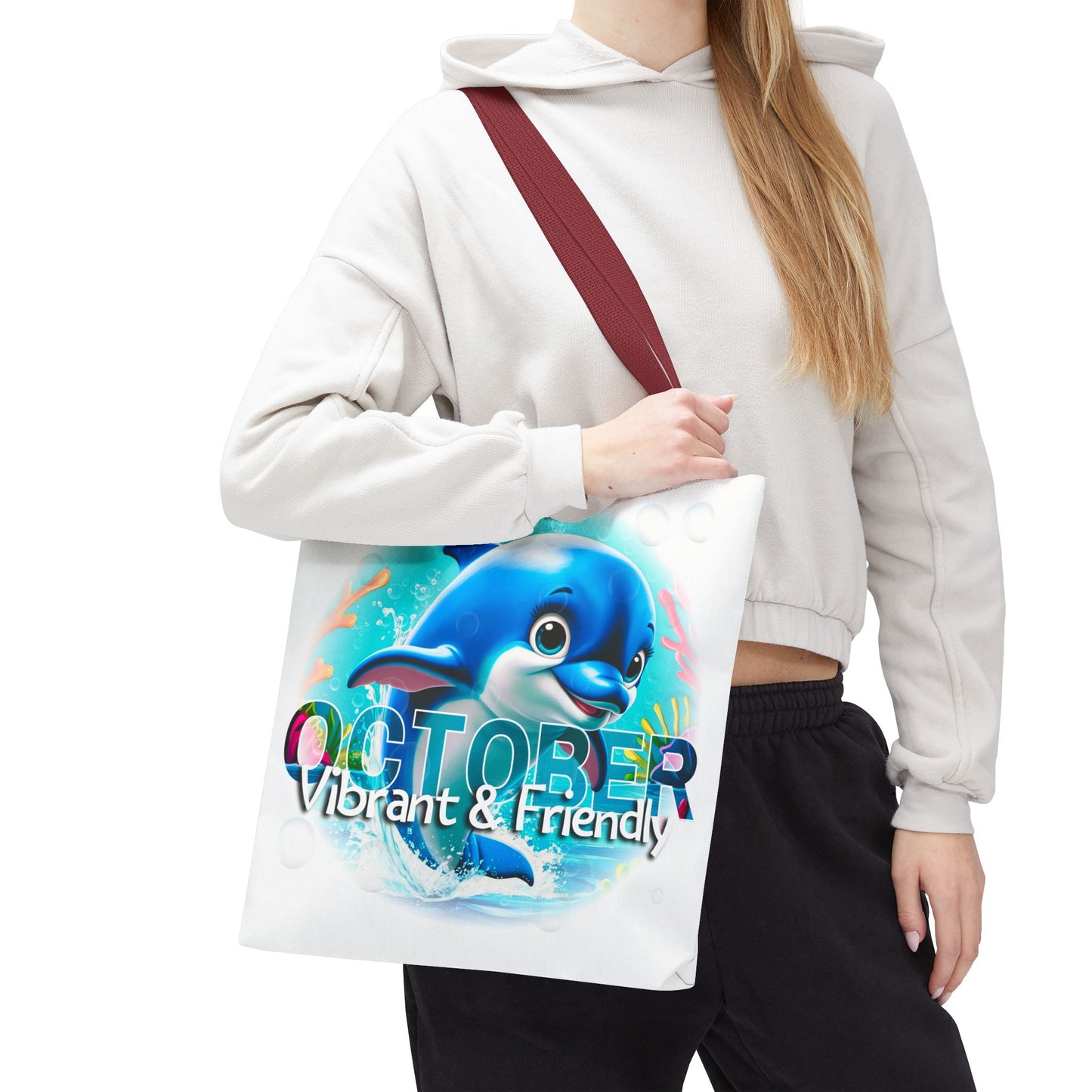 Kids birth month beach tote bag with colorful dolphin October design and maroon strap
