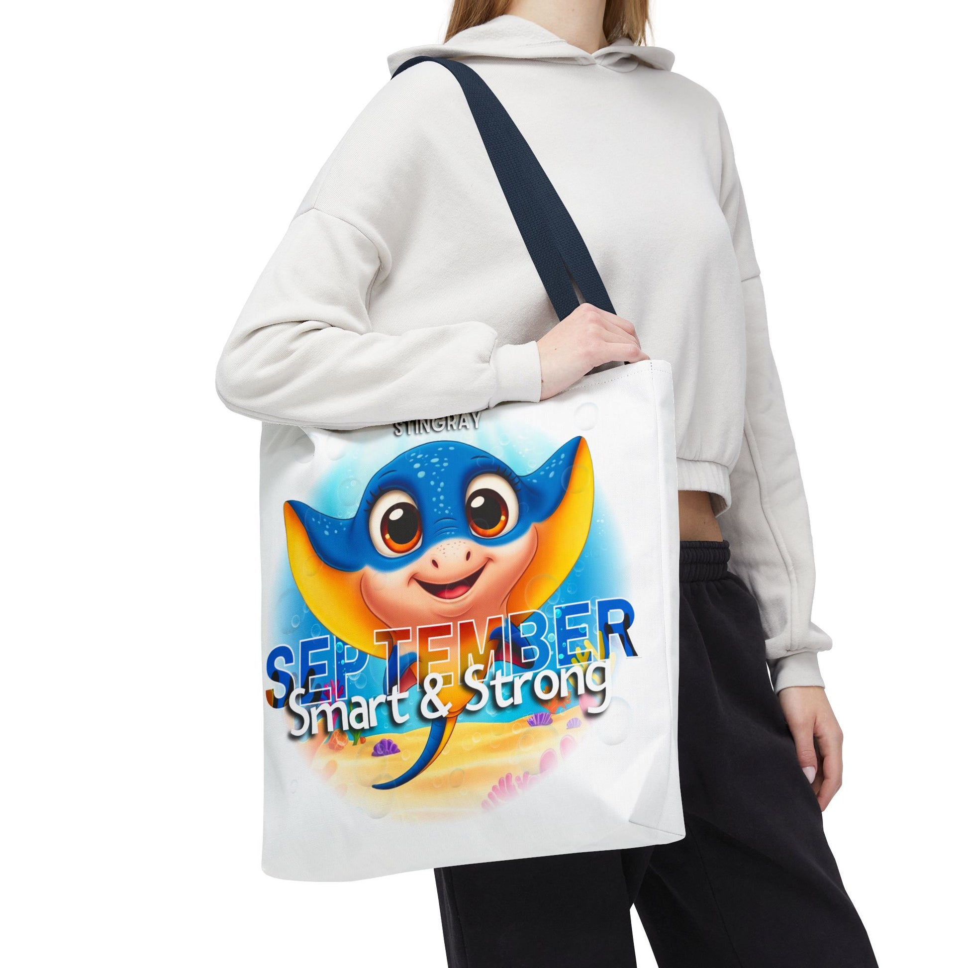 Kids birth month beach tote bag with colorful September stingray design and smart and strong text