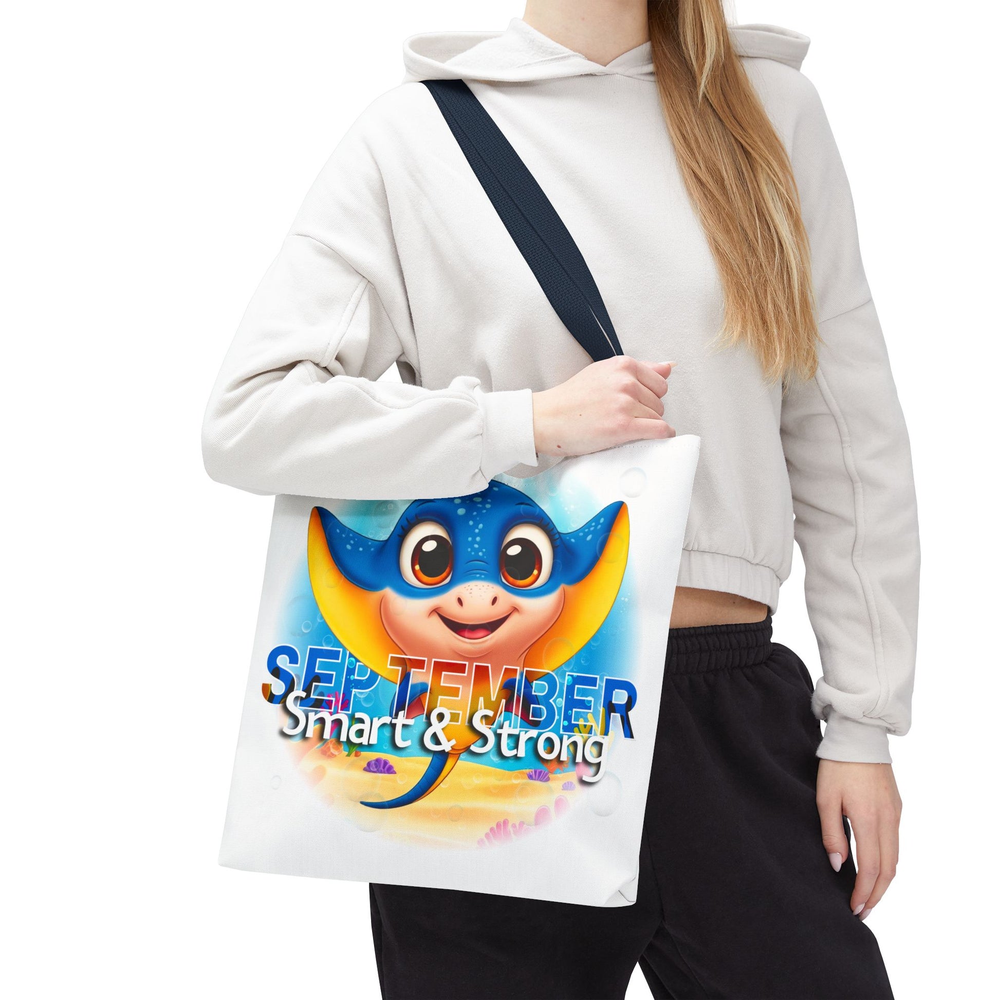 Kids birth month beach tote bag featuring colorful September stingray design smart and strong