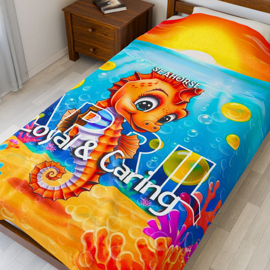 Kids birth month blanket featuring colorful seahorse design with coral and ocean background on bed
