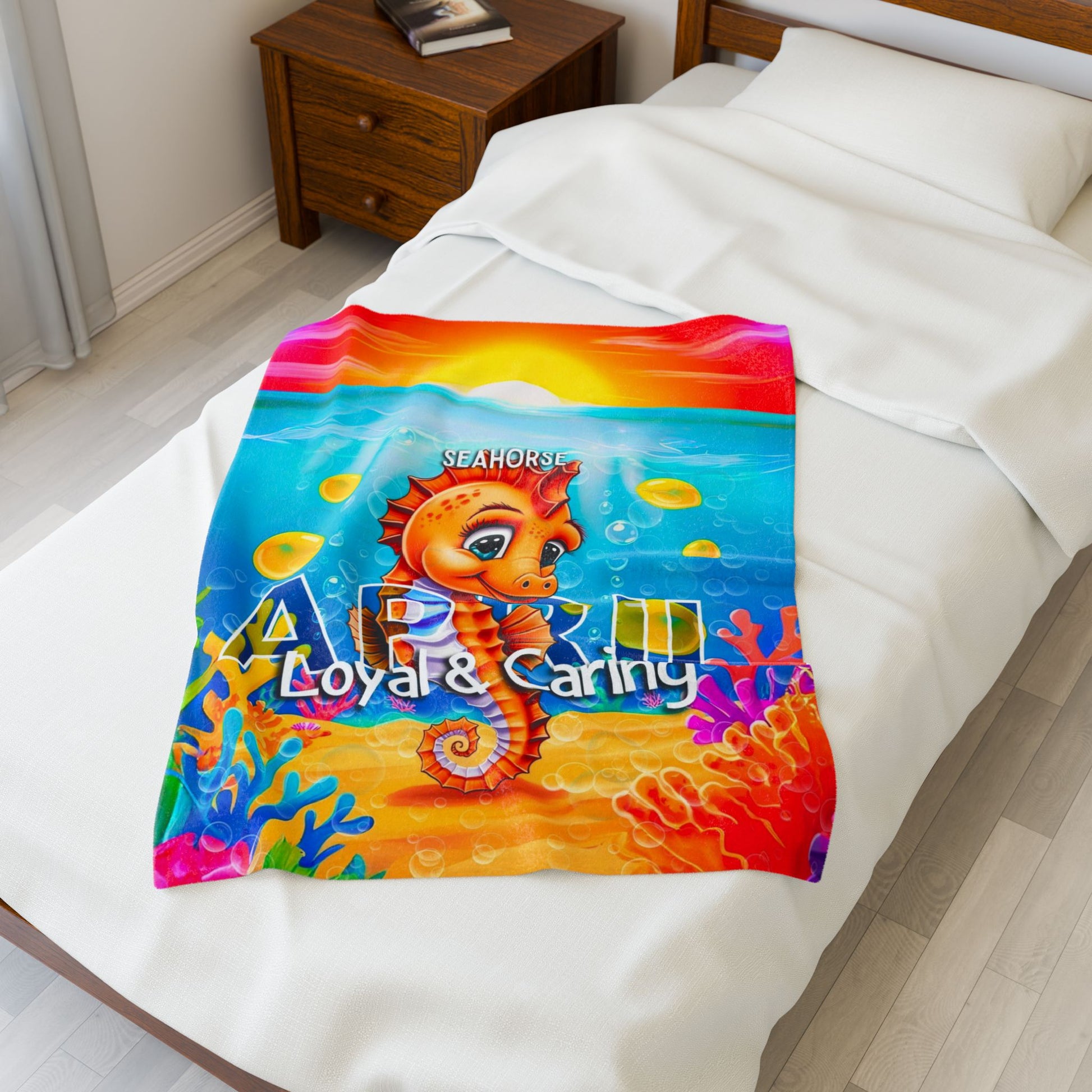 Colorful kids birth month blanket featuring April seahorse with loyal and caring traits by Printify