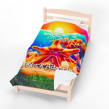 Colorful kids birth month blanket featuring a cheerful starfish design on a wooden bed