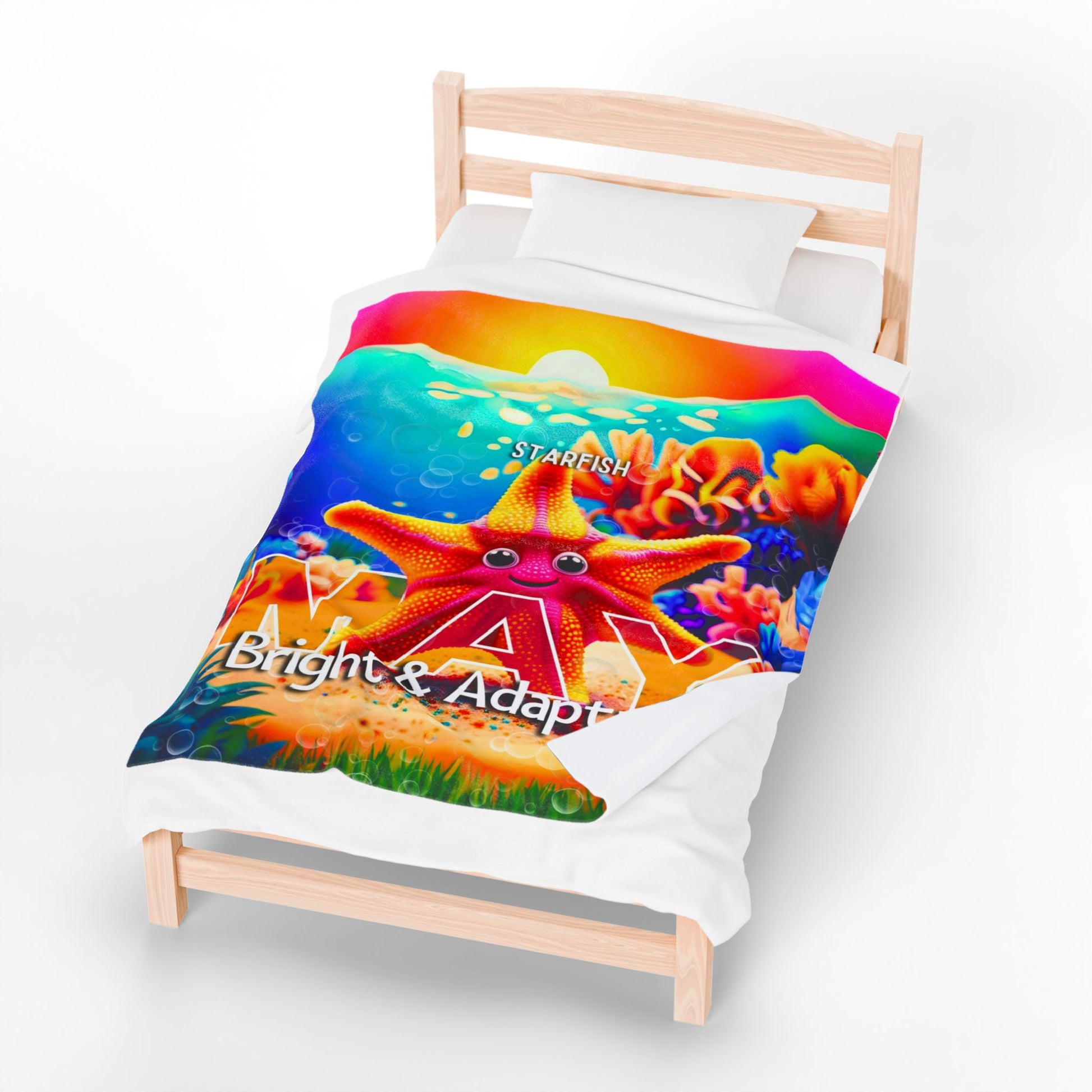Kids birth month blanket with colorful starfish design and bright underwater theme on single wooden bed