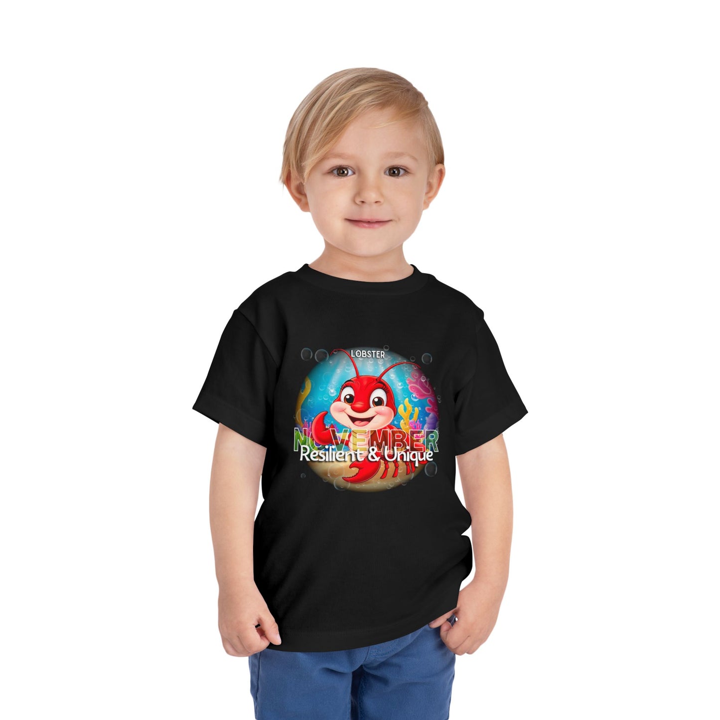 Child wearing a black kids birth month tshirt with November lobster design 
