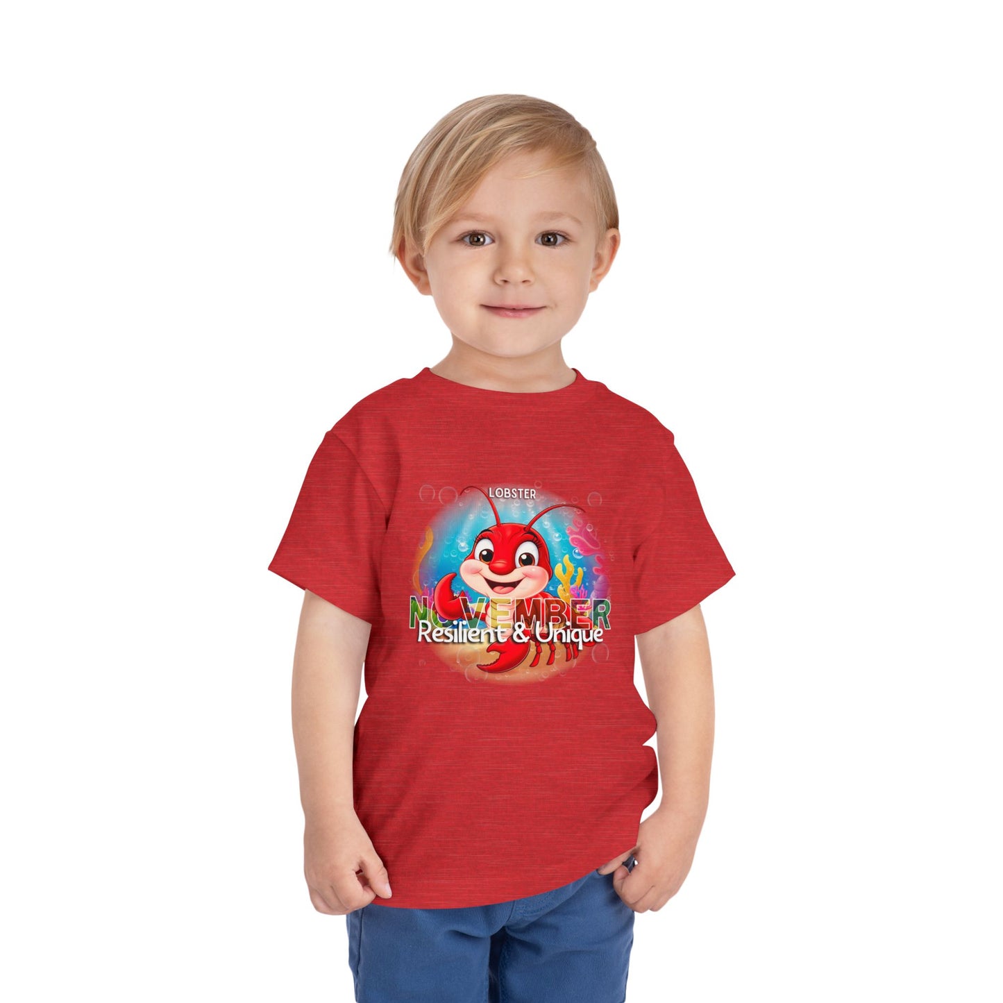 Toddler wearing red kids birth month tshirt with colorful November lobster design 