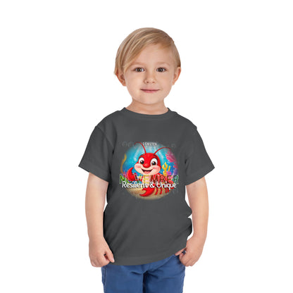 Toddler wearing a kids birth month tshirt featuring a November lobster design with resilient and unique text