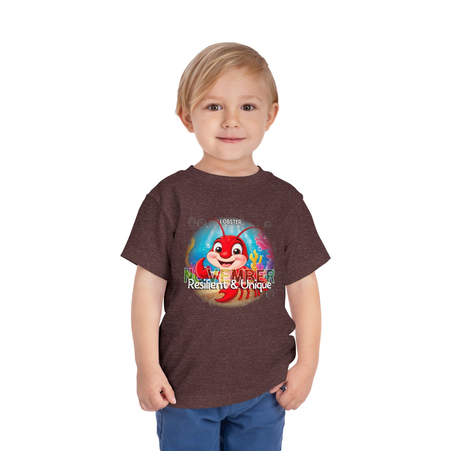 Toddler wearing kids birth month tshirt with colorful November lobster design