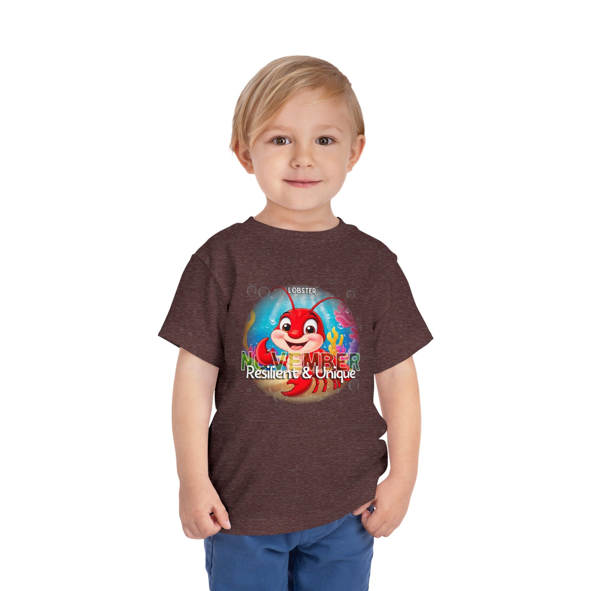 Toddler wearing kids birth month tshirt with colorful November lobster design