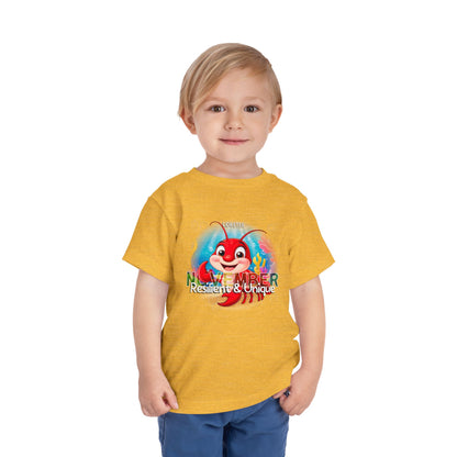 Child wearing yellow kids birth month tshirt with November crab graphic and resilient unique text