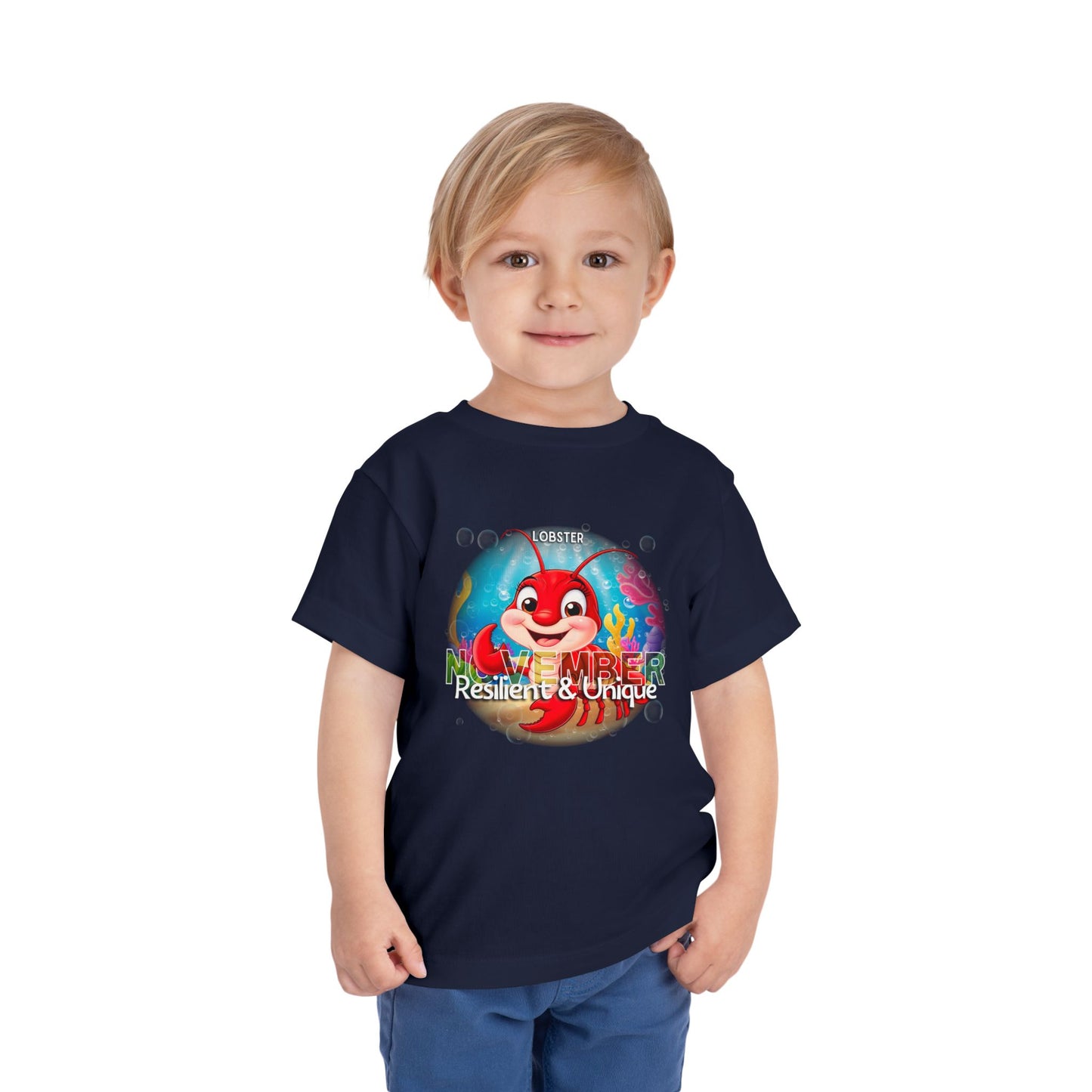 Child wearing navy kids birth month tshirt with November lobster design and Resilient Unique text