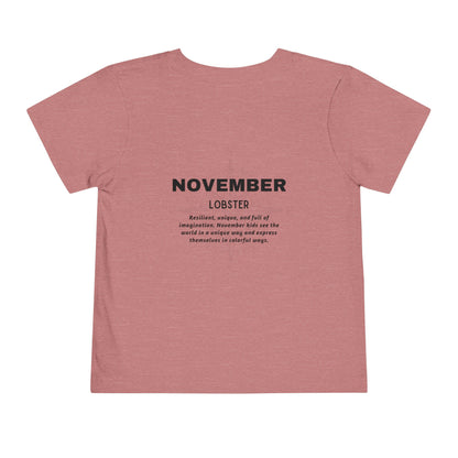 Kids birth month tshirt in pink featuring November lobster design with inspirational text