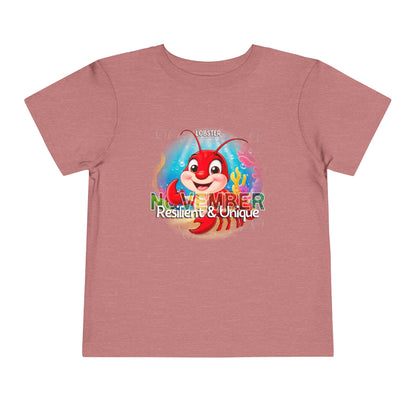 Pink kids birth month tshirt with colorful lobster graphic and November text for kids