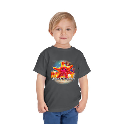 Child wearing a black kids birth month tshirt with bright starfish design for May