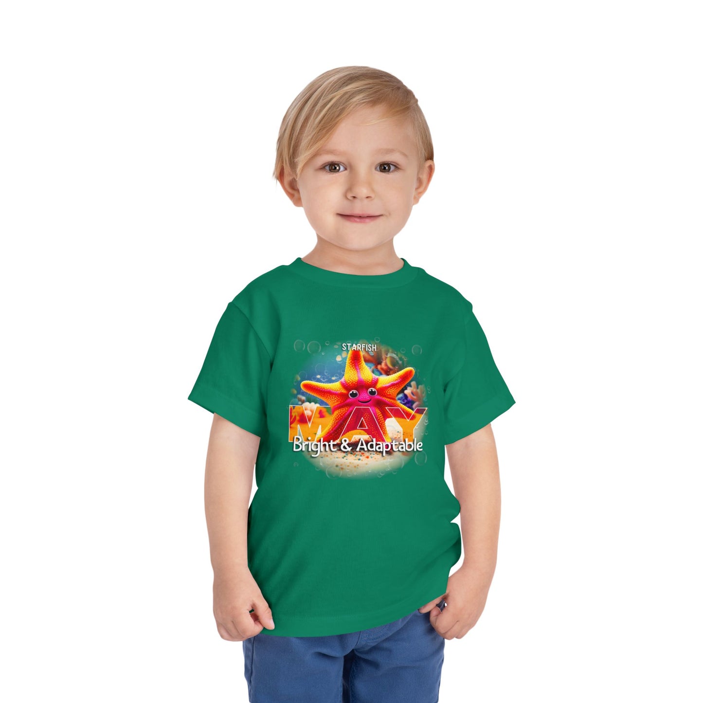 Kids birth month tshirt featuring bright starfish design on green shirt worn by child