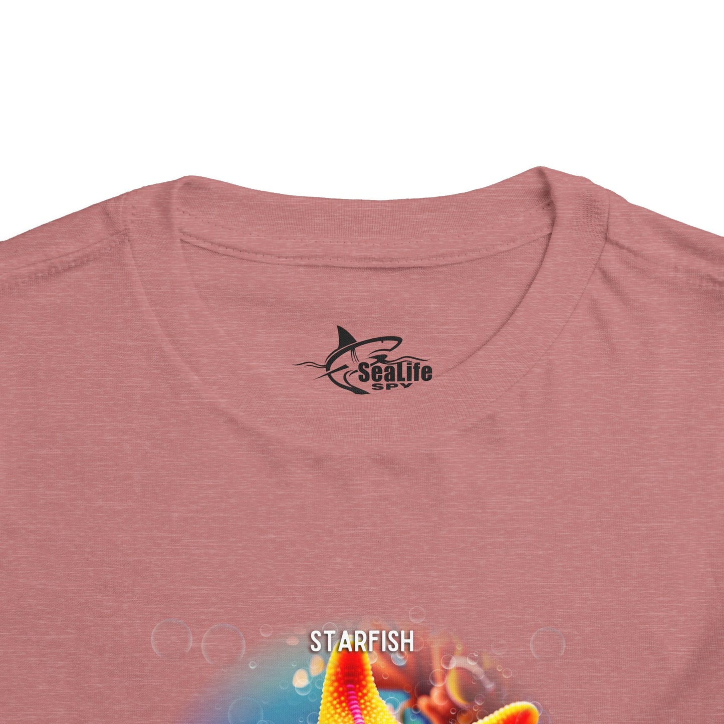 Kids birth month tshirt in pink featuring colorful starfish graphic design