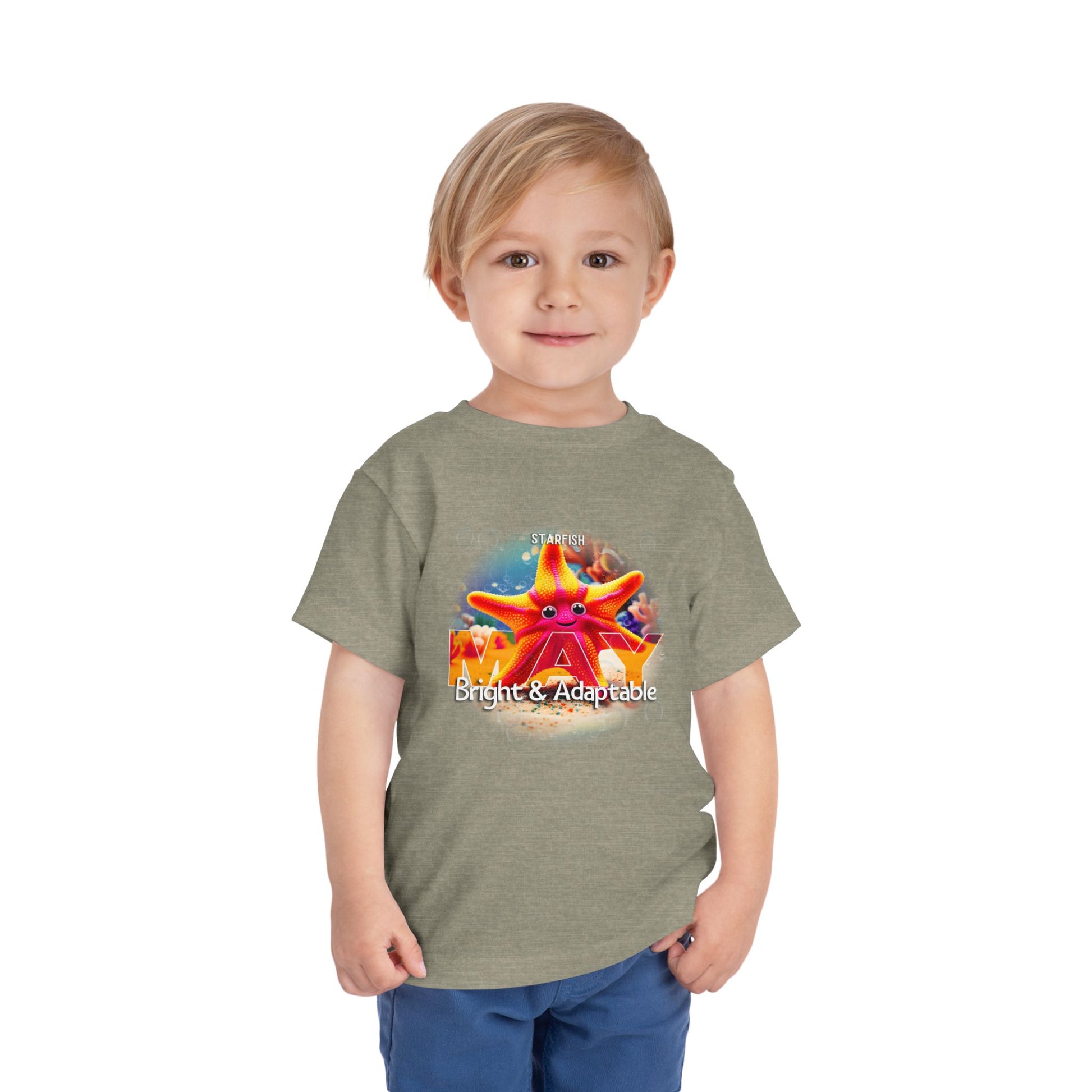 Toddler wearing kids birth month tshirt with colorful starfish design and bright adaptable theme