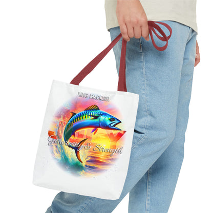 Person holding birth month beach tote with colorful King Mackerel design and red straps