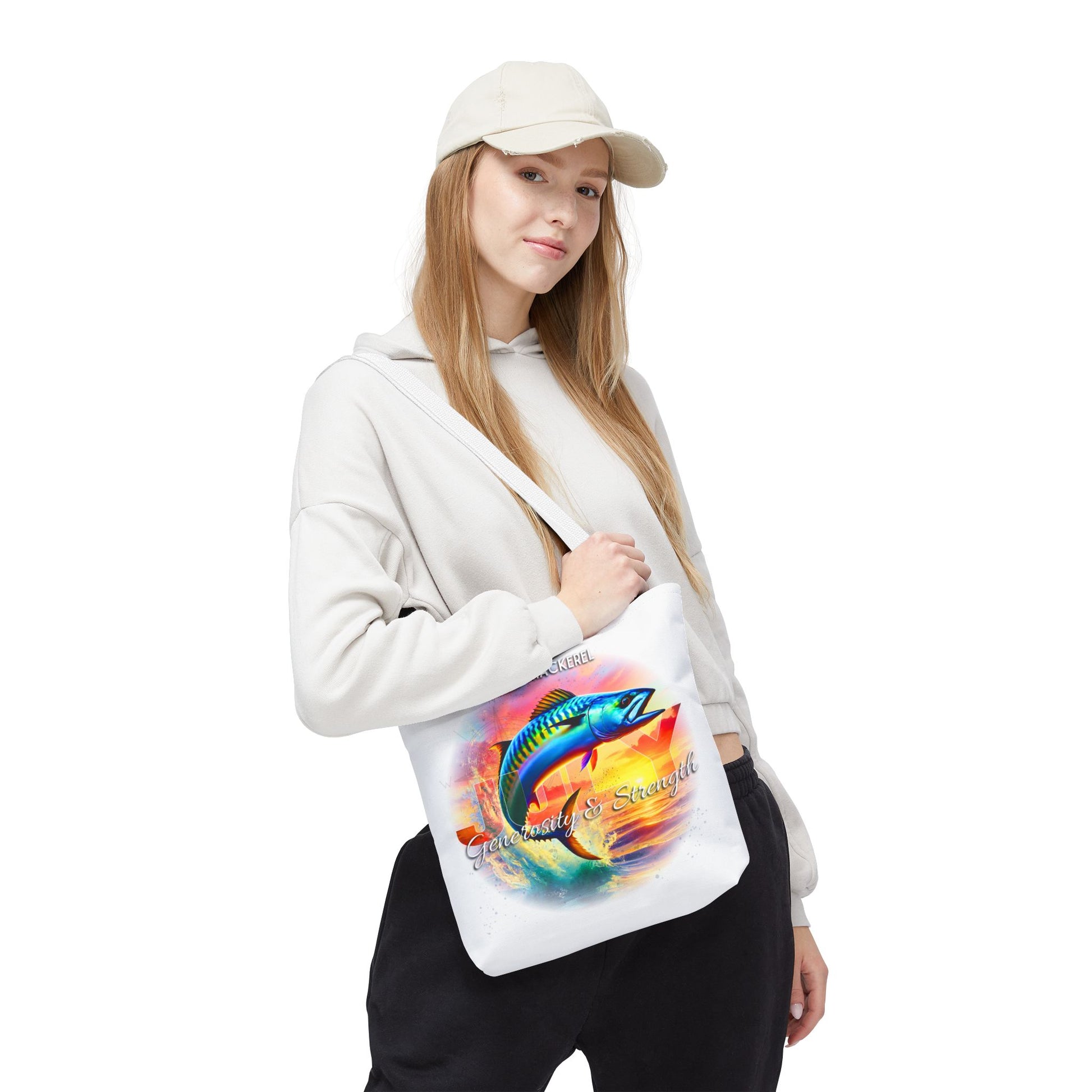 Birth month beach tote with colorful fish design worn by woman in casual outfit