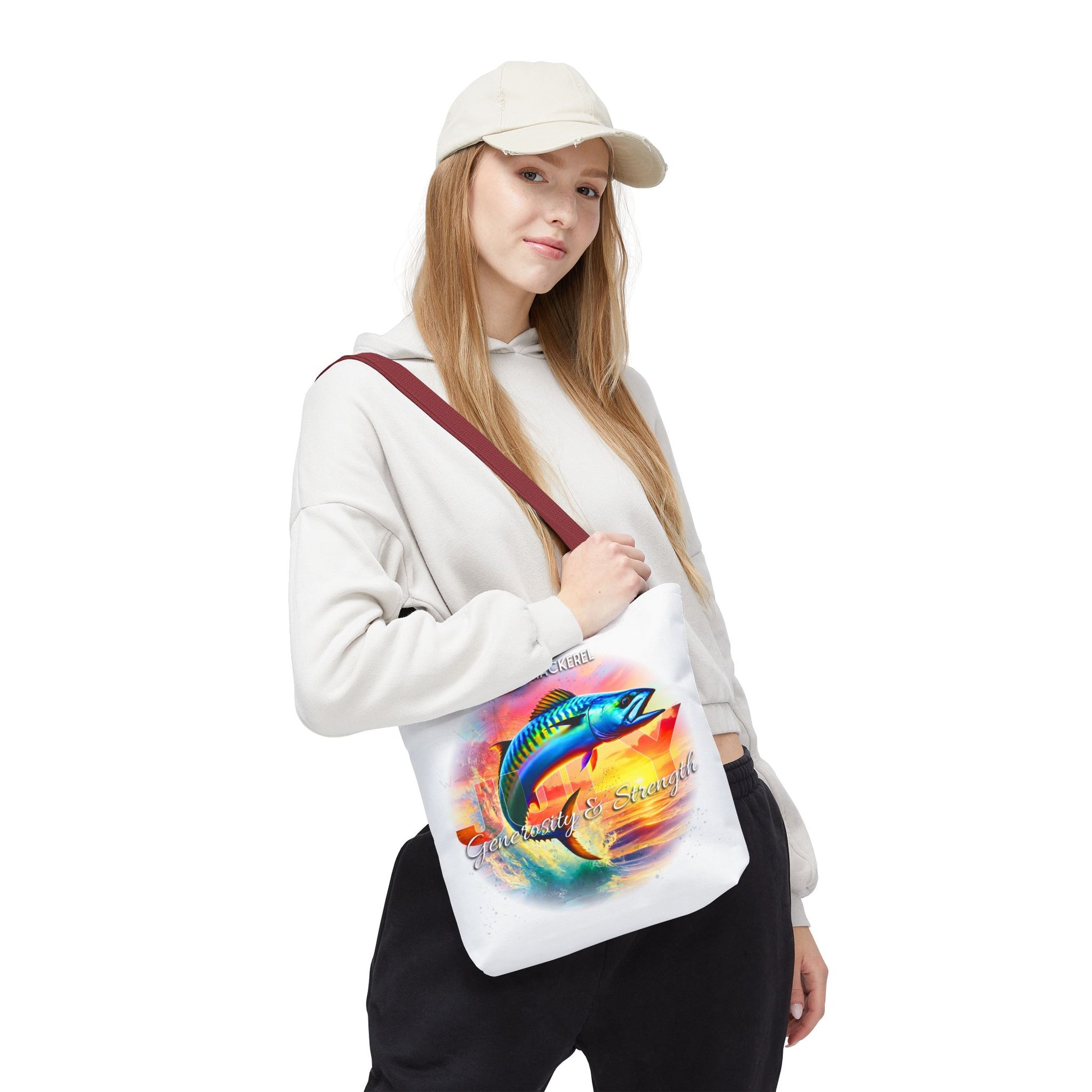 Birth month beach tote featuring colorful fish design carried by woman in casual outfit