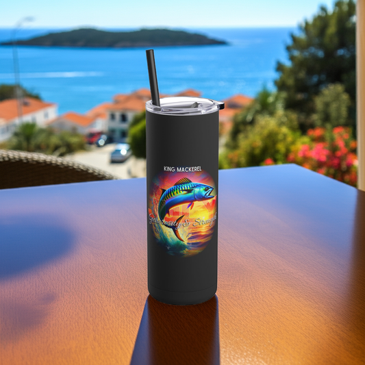 Black birth month travel tumbler featuring colorful king mackerel fish design on wooden table outdoors