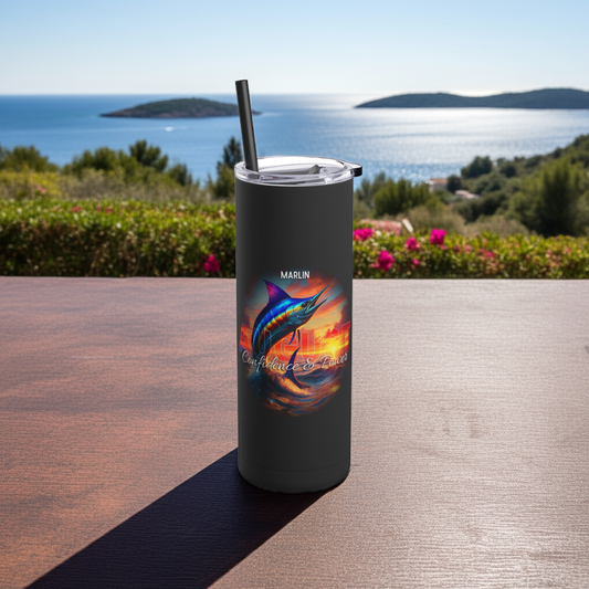 Birth month travel tumbler featuring colorful marlin design with lid and straw outdoors